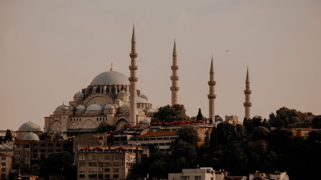 Majestic view of Suleymaniye Mosque with its iconic minarets at sunset in Istanbul, Turkey.