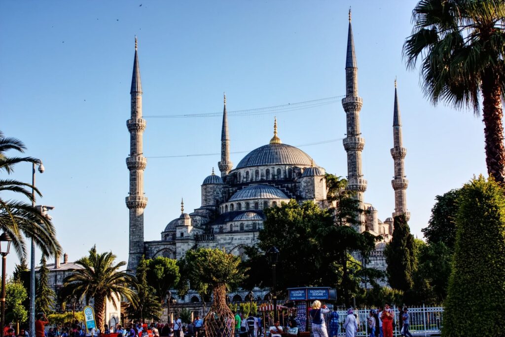 Stunning view of the Sultan Ahmed Mosque, showcasing its architectural beauty and minarets against a clear sky.